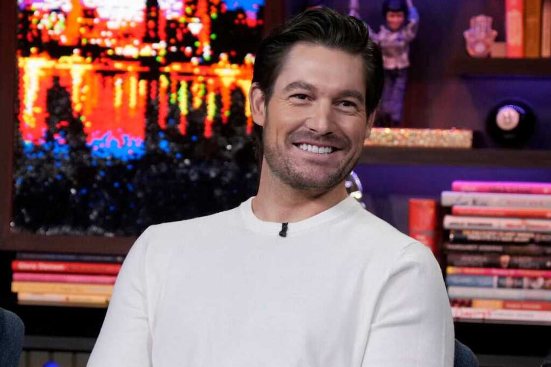 Craig Conover in a white top during an interview with Andy Cohen