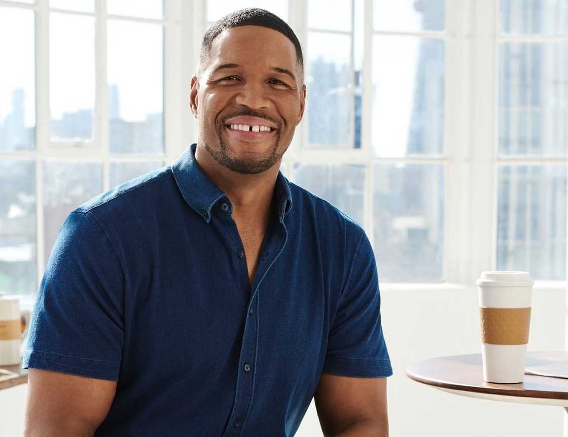 Michael Strahan smiles during a promo shoot for his clothing line.