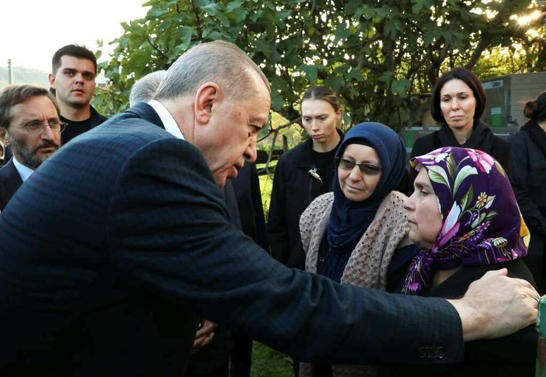 President Recep Tayyip Erdogan (L)at the funeral of a dead miner President Recep Tayyip Erdogan (L)at the funeral of a dead miner