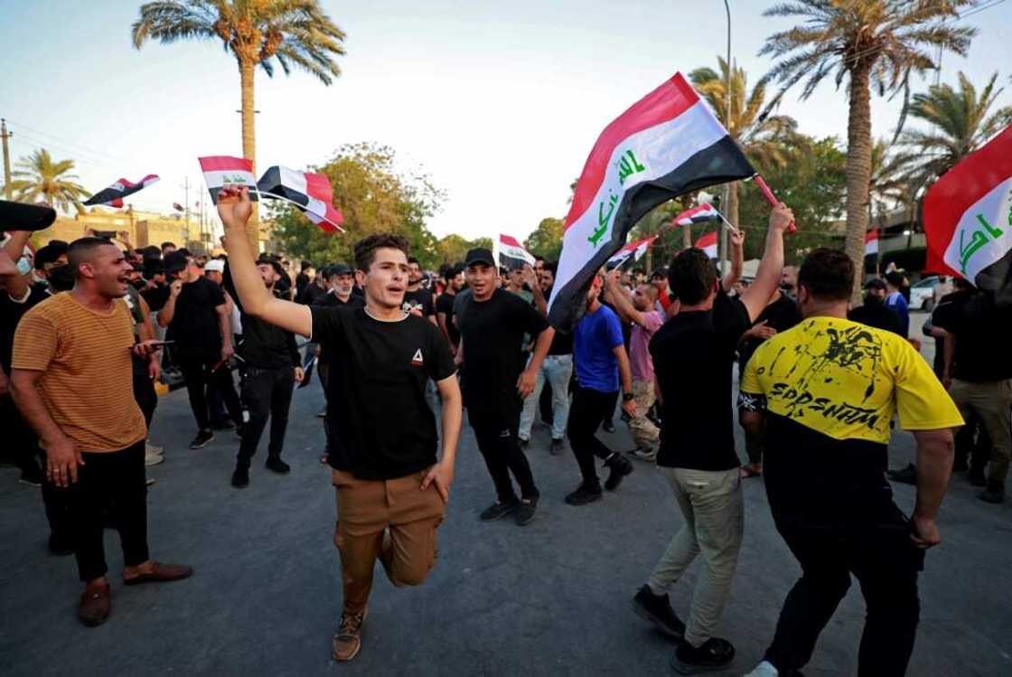 Supporters of Iraq's Coordination Framework protest on a bridge leading to the capital Baghdad's high-security Green Zone