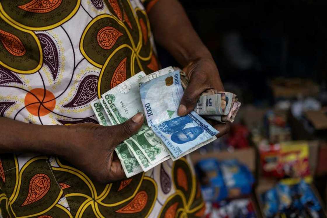 Nigeria's central bank has loosened control on the exchange rate for the naira against foreign currencies Nigeria's central bank has loosened control on the exchange rate for the naira against foreign currencies