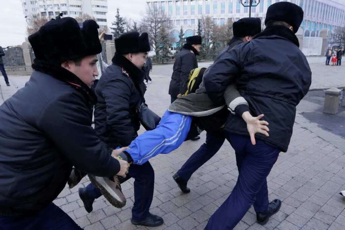 Kazakh police detain a protester at a rally during Sunday's presidential election Kazakh police detain a protester at a rally during Sunday's presidential election