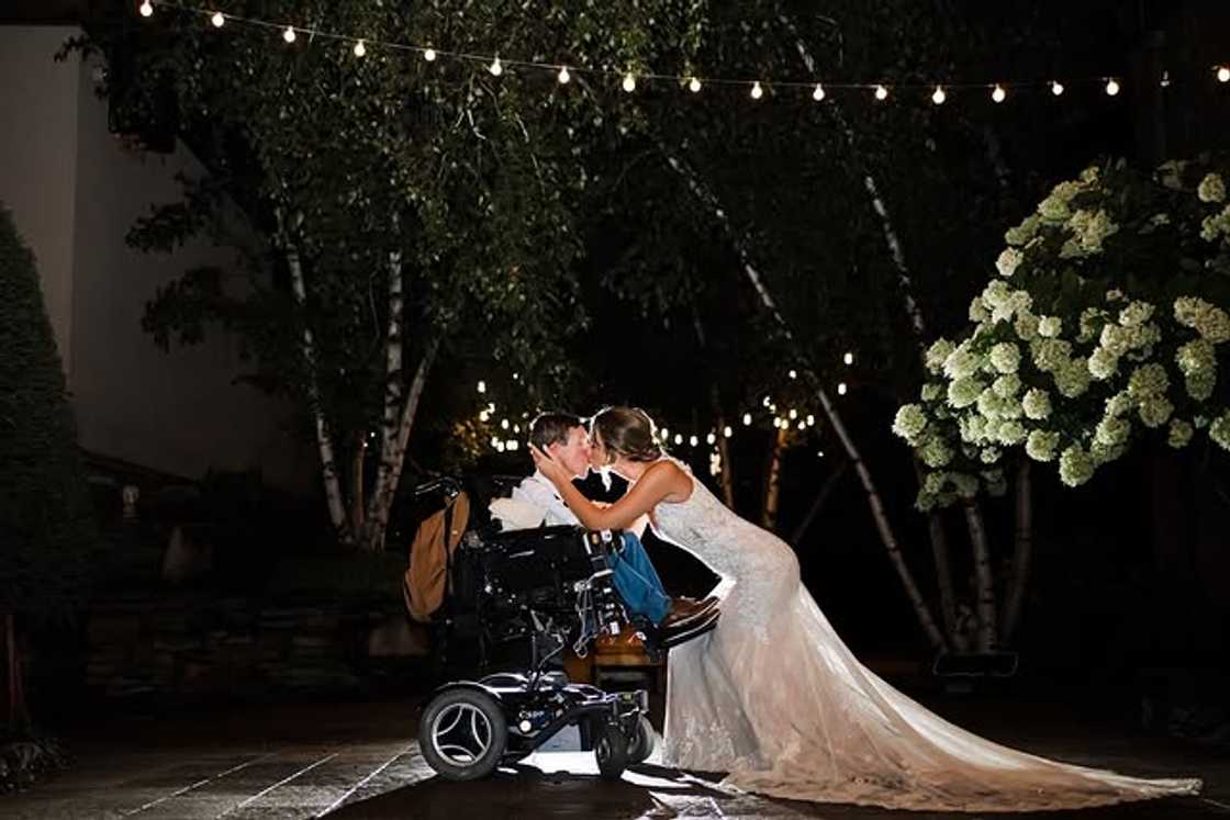 Hannah Burcaw and Shane Burcaw kiss on their wedding day