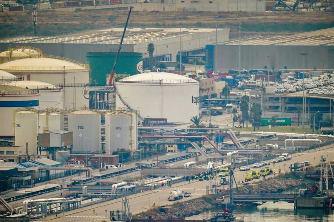 Emergency services deploy at Barcelona's port following an explosion of a tank containing a highly flammable substance Emergency services deploy at Barcelona's port following an explosion of a tank containing a highly flammable substance