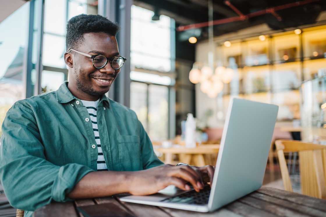 A young male using laptop computer.