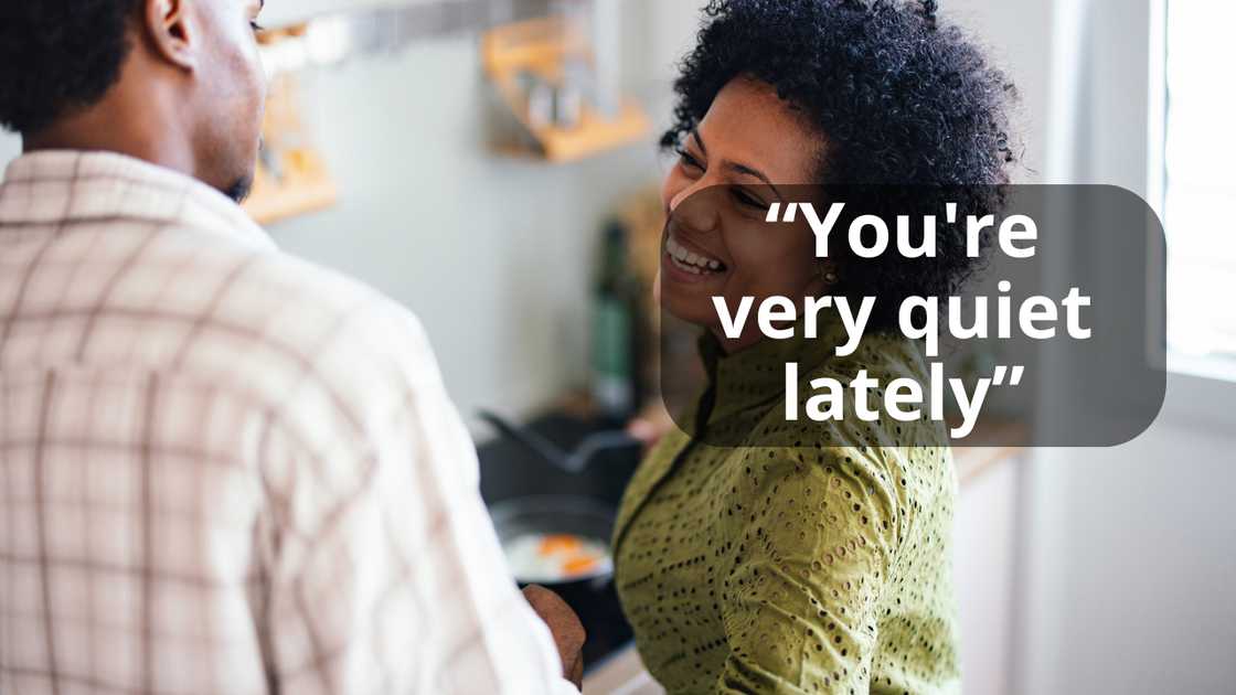 A mother talking to her son in the kitchen