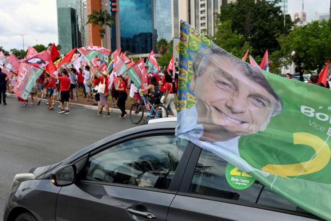 After a bitterly divisive campaign and inconclusive first-round vote, Brazil will elect its next president on October 30 2022, in a cliffhanger runoff between far-right incumbent Jair Bolsonaro and veteran leftist Luiz Inacio Lula da Silva After a bitterly divisive campaign and inconclusive first-round vote, Brazil will elect its next president on October 30 2022, in a cliffhanger runoff between far-right incumbent Jair Bolsonaro and veteran leftist Luiz Inacio Lula da Silva
