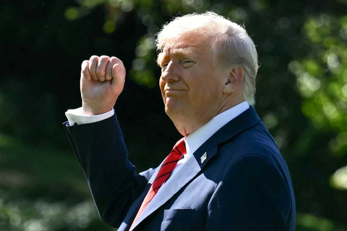 US President Donald Trump gestures as he walks to Marine One on the South Lawn of the White House in Washington, DC, on October 10, 2025, on his way to Walter Reed National Military Medical Center to receive a medical checkup. US President Donald Trump gestures as he walks to Marine One on the South Lawn of the White House in Washington, DC, on October 10, 2025, on his way to Walter Reed National Military Medical Center to receive a medical checkup.