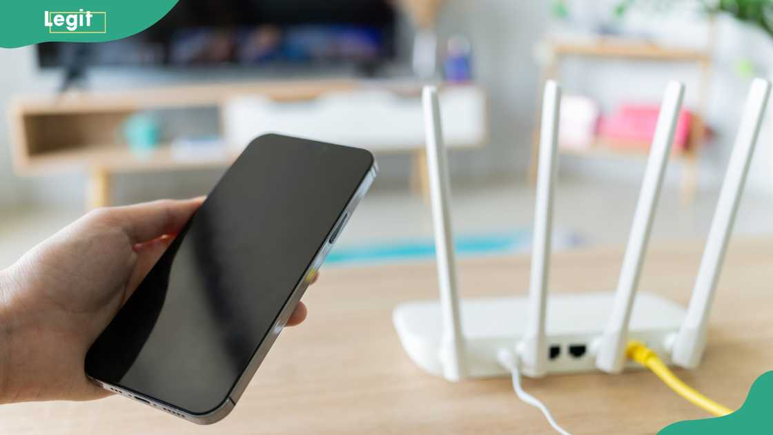 A person trying to regain a lost Wi-Fi connection A person trying to regain a lost Wi-Fi connection