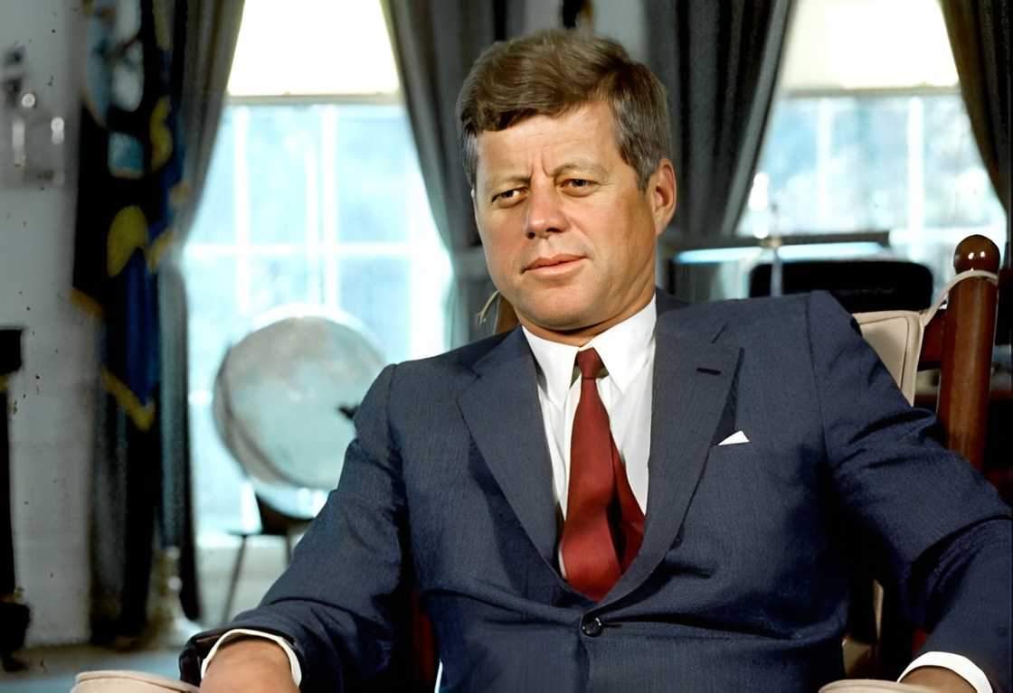 US President John F Kennedy sits in a rocking chair in the White House's Oval Office