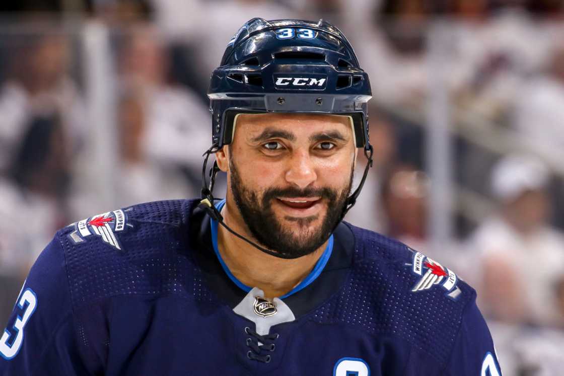 Dustin Byfuglien looks on during a second period face-off against the St. Louis Blues