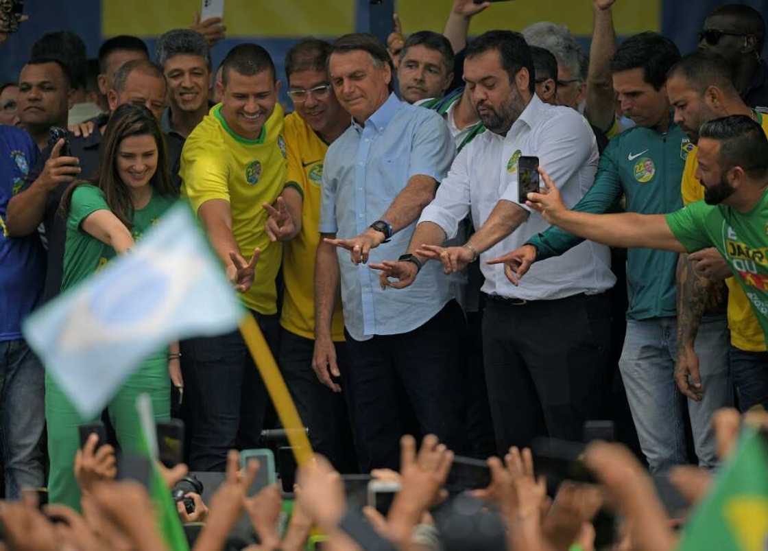 Bolsonaro greets supporters at a rally Bolsonaro greets supporters at a rally