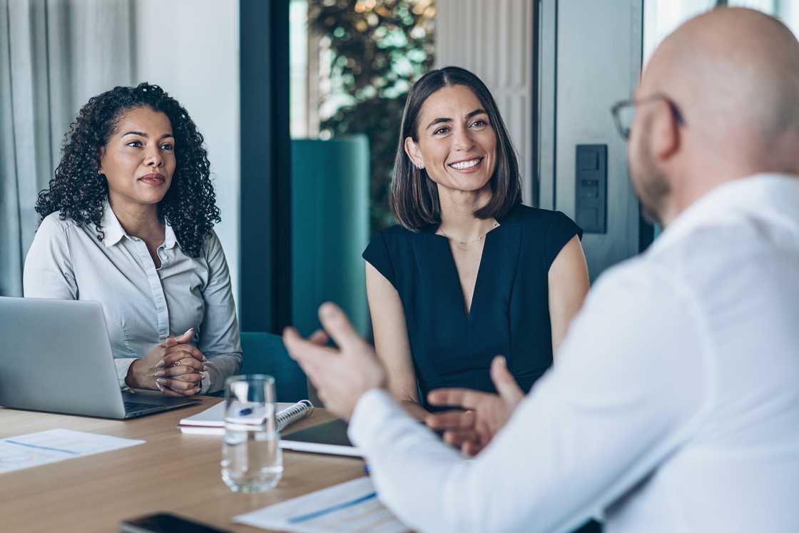 An interview room with the candidate, the HR manager, and panellist. An interview room with the candidate, the HR manager, and panellist.