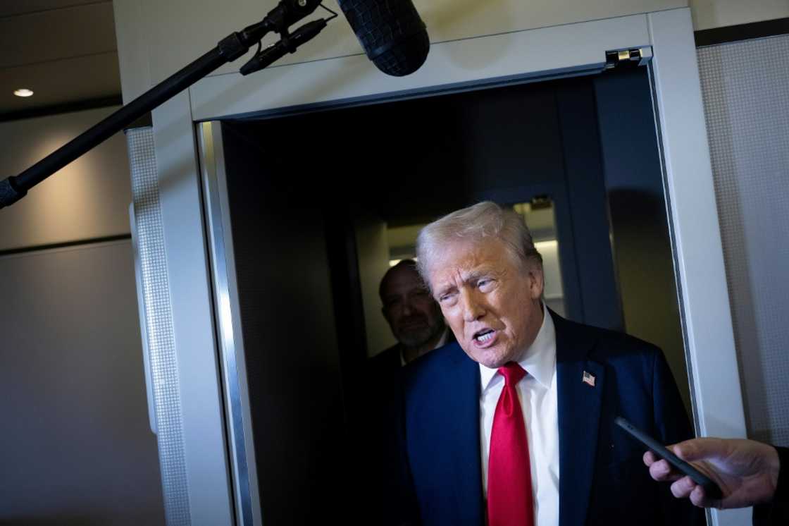 US President Donald Trump aboard Air Force One US President Donald Trump aboard Air Force One
