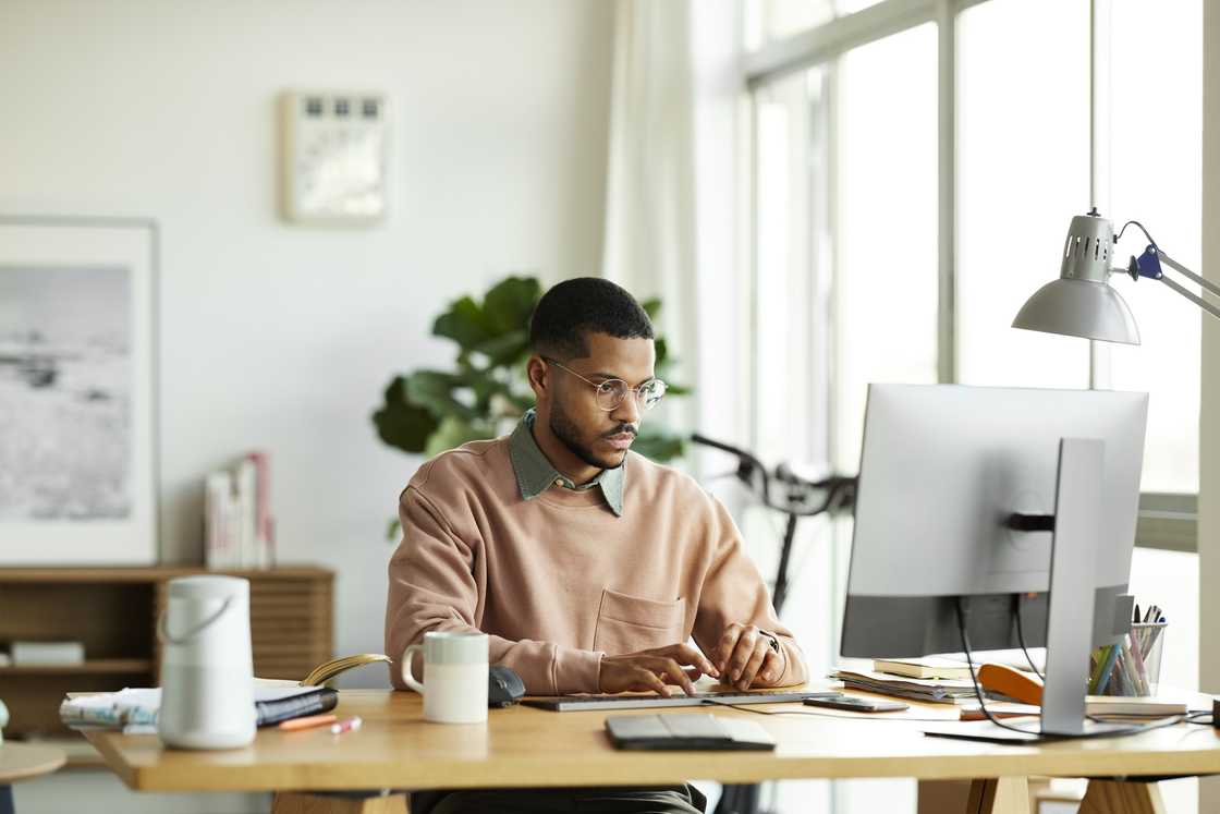 A young businessman working at home office. A young businessman working at home office.