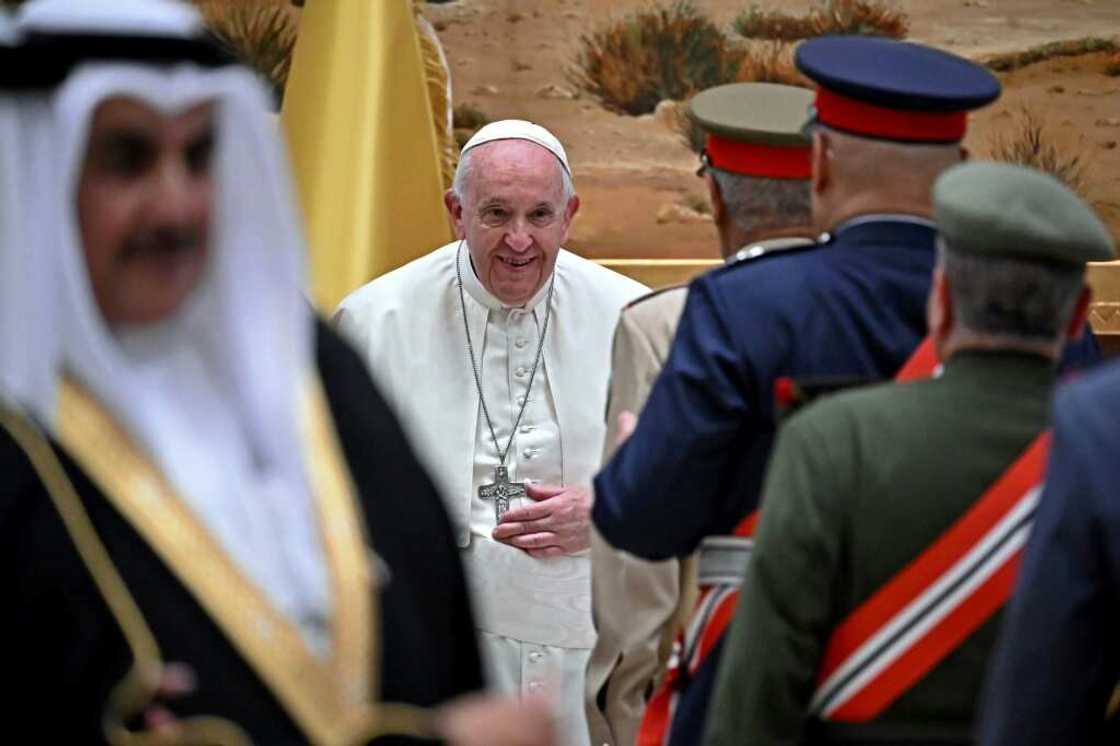 Pope Francis (C) greet dignitaries at the airport in Awali, south of the Bahraini capital Manama Pope Francis (C) greet dignitaries at the airport in Awali, south of the Bahraini capital Manama