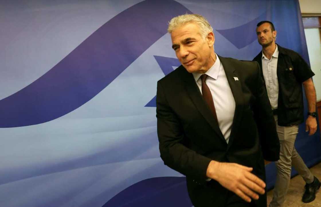Israel's Prime Minister Yair Lapid arrives to attend the first cabinet meeting in Jerusalem on July 3: on Tuesday, Lapid is in Paris on his first foreign trip as premier Israel's Prime Minister Yair Lapid arrives to attend the first cabinet meeting in Jerusalem on July 3: on Tuesday, Lapid is in Paris on his first foreign trip as premier
