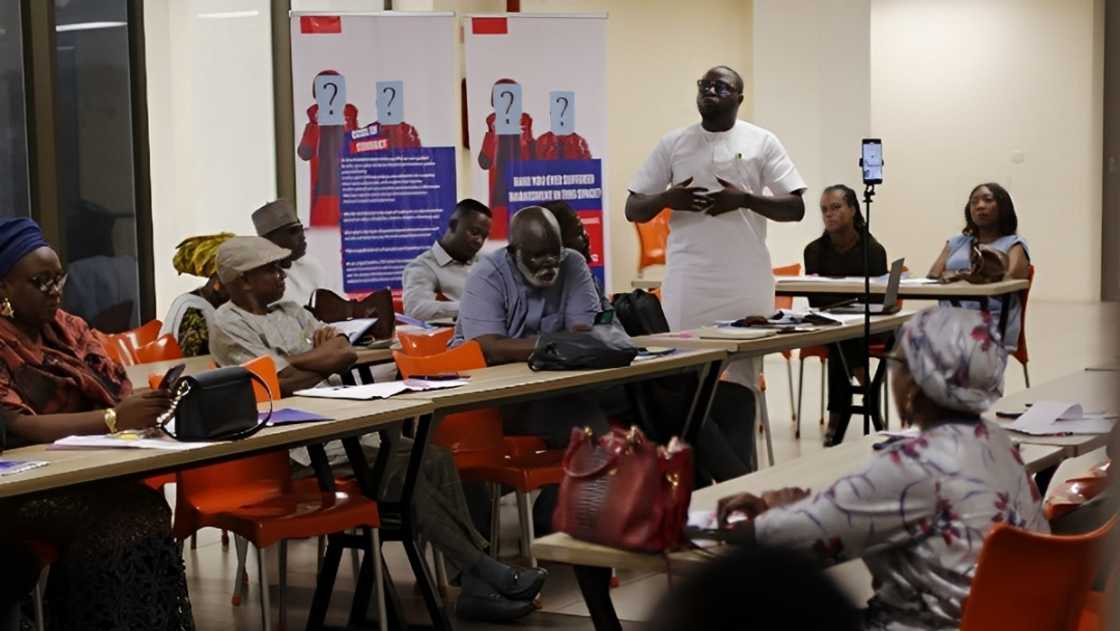 Social and civil work stakeholders siting a lecture hall listening to a lecture. Social and civil work stakeholders siting a lecture hall listening to a lecture.