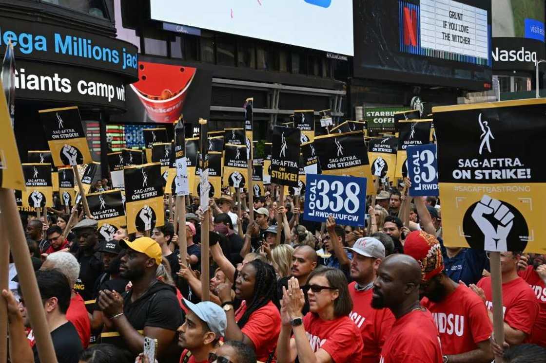 Screen Actors Guild (SAG-AFTRA) members and supporters cheer at a strike rally in Times Square Screen Actors Guild (SAG-AFTRA) members and supporters cheer at a strike rally in Times Square