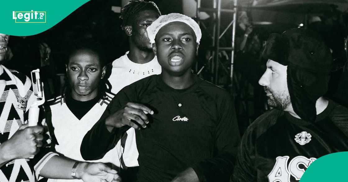 Peller gives out money to people at the airport as he lands in Nigeria. Peller gives out money to people at the airport as he lands in Nigeria.