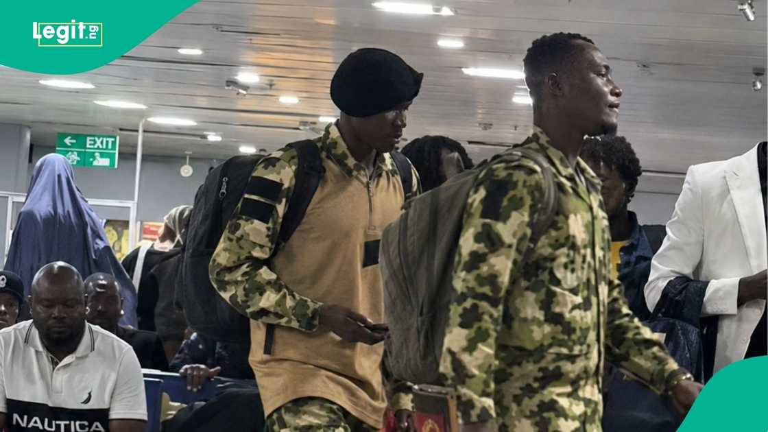 Passengers at a Nigerian airport applauded soldiers in camouflage.