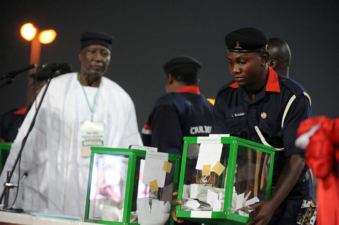 An NSCDC officer in uniform carrying a ballot box through a crowd during a party primary in Nigeria An NSCDC officer in uniform carrying a ballot box through a crowd during a party primary in Nigeria