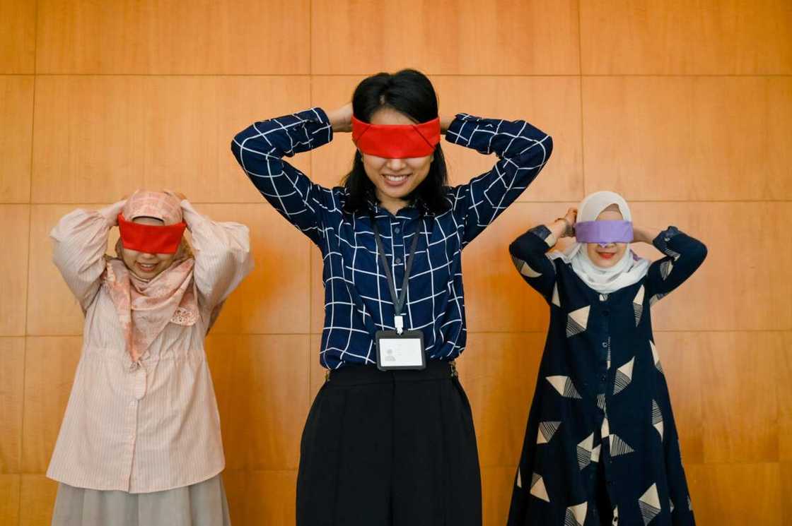 A family playing a blindfold game