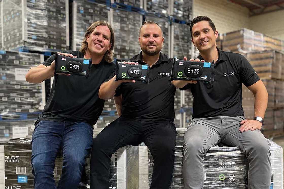 Dude Wipes co-founders Sean Riley, Ryan Meegan, Jeff Klimkowski posing with the wipes
