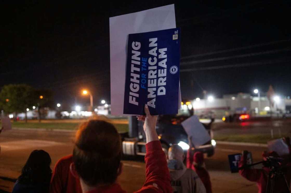 UAW members picket outside of the Local 900 headquarters across the street from the Ford assembly plant in Wayne, Michigan