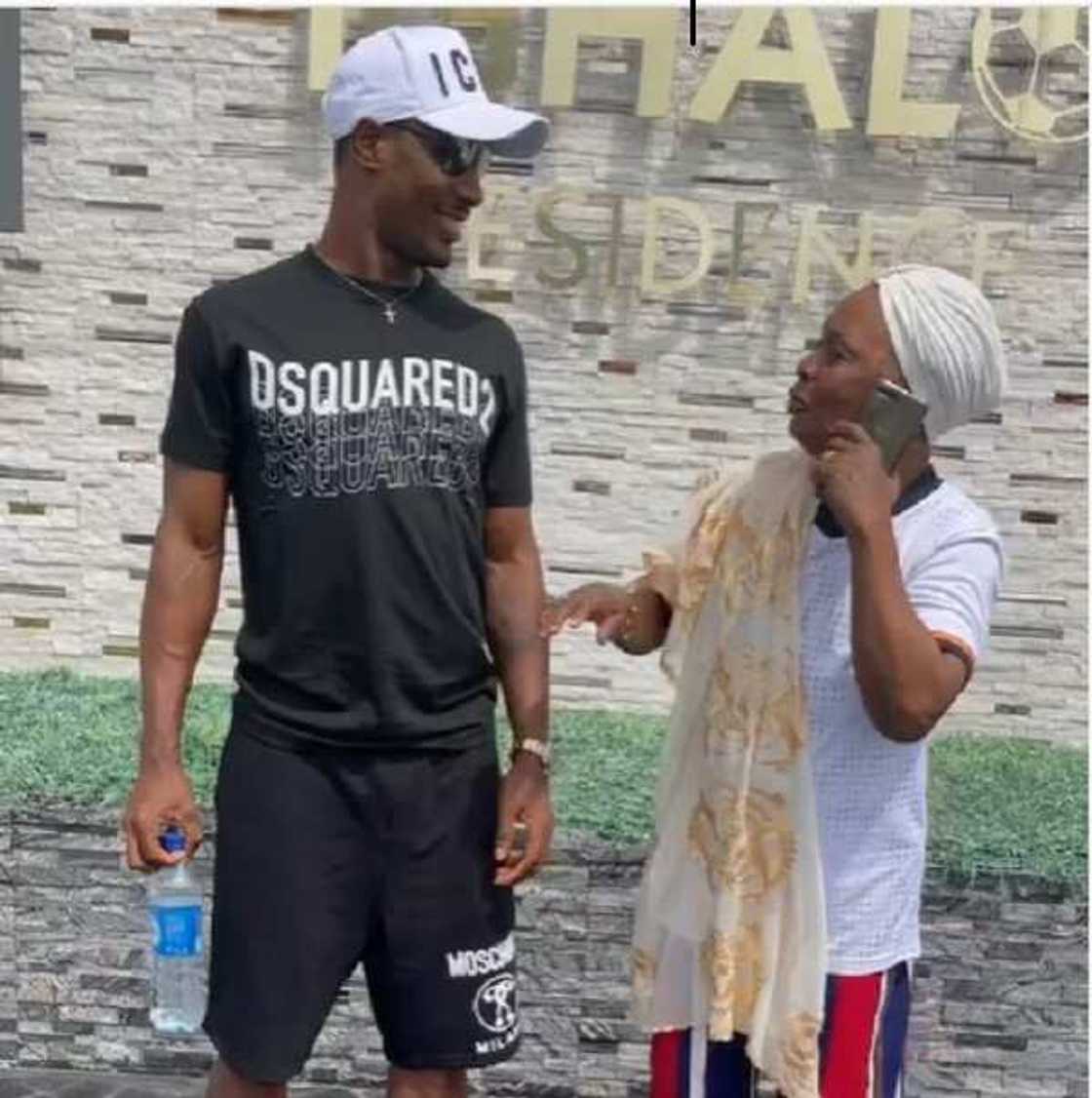 Odion Ighalo Jokes About Letting Go of Mother After She Photobombed Him in His Lekki Mansion