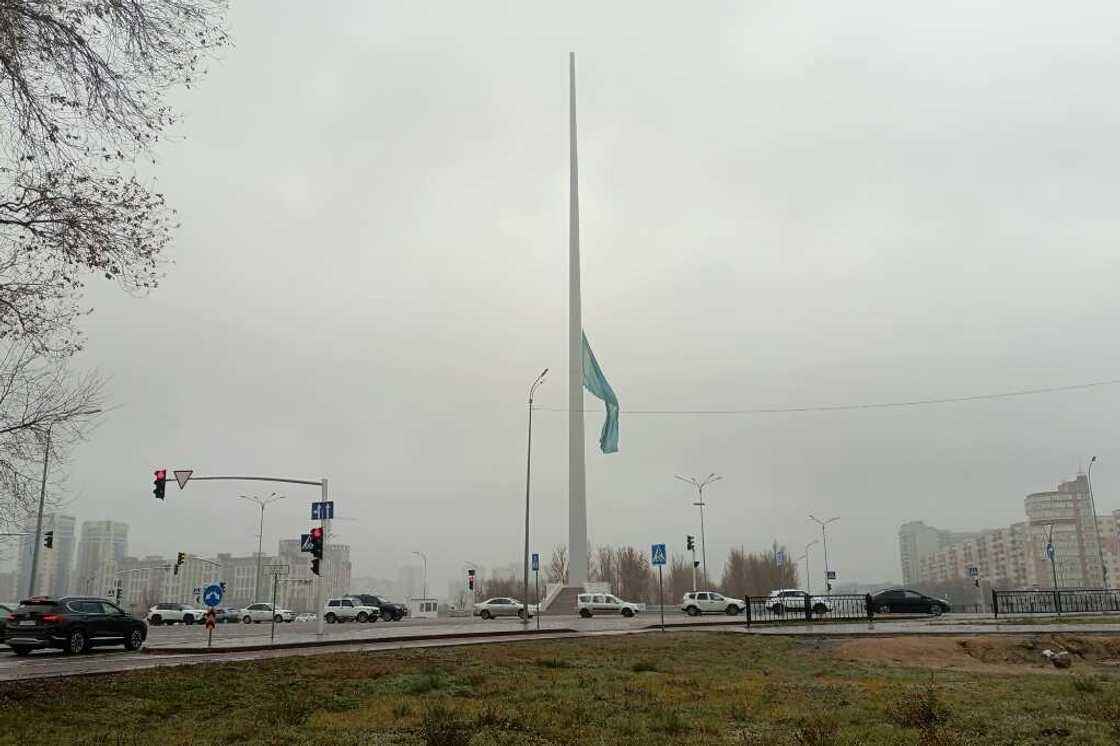 The Kazakh national flag flies at half-mast to mark a day of national mourning for the dead miners The Kazakh national flag flies at half-mast to mark a day of national mourning for the dead miners