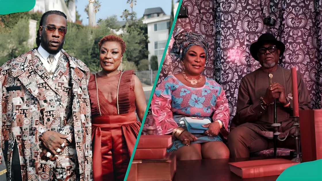 Burna Boy with his mum and his parents sitting at an event Burna Boy with his mum and his parents sitting at an event