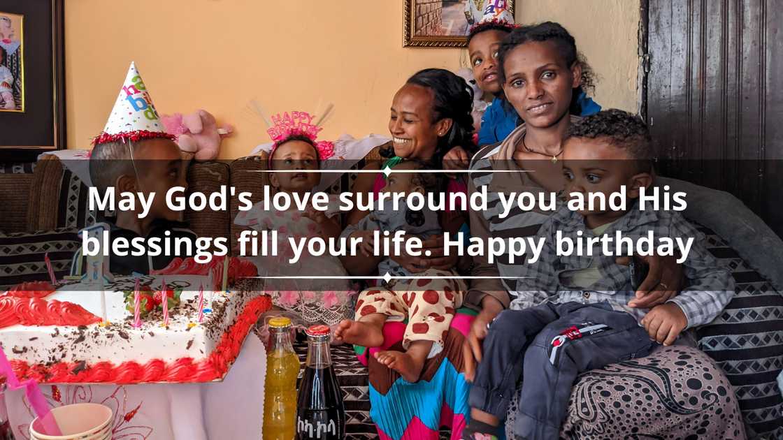 A family celebrating a child's birthday in their living room
