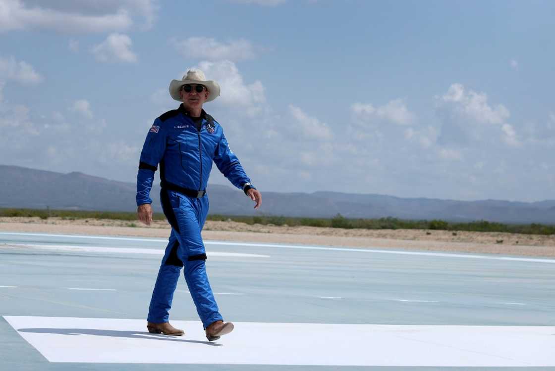 Jeff Bezos walks near Blue Origin's New Shepard after flying into space on July 20, 2021 in Van Horn, Texas Jeff Bezos walks near Blue Origin's New Shepard after flying into space on July 20, 2021 in Van Horn, Texas