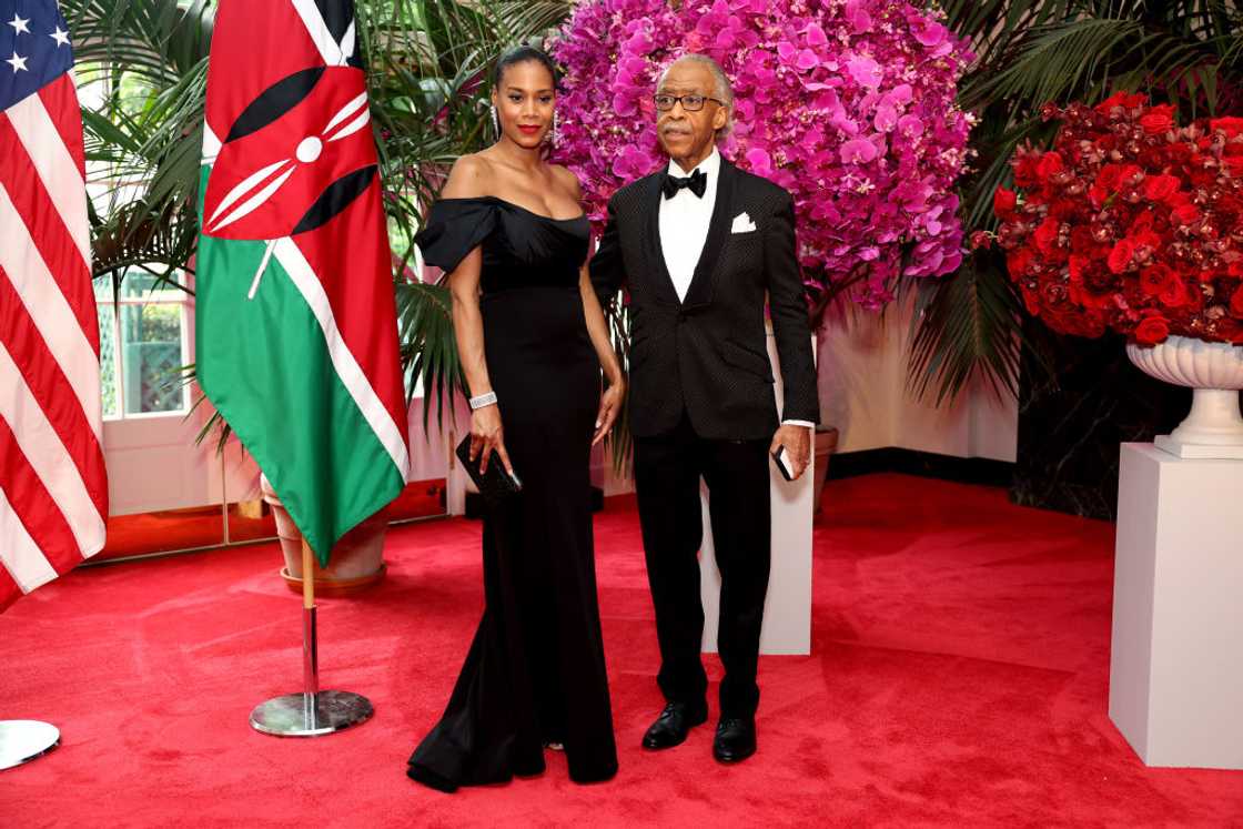 Reverend Al Sharpton and Aisha McShaw poses at the White House