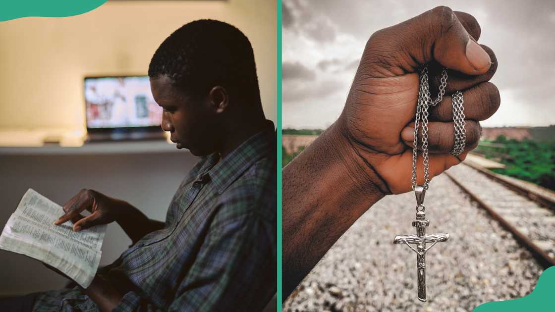 A man reading a bible and another holding cross along the railway.
