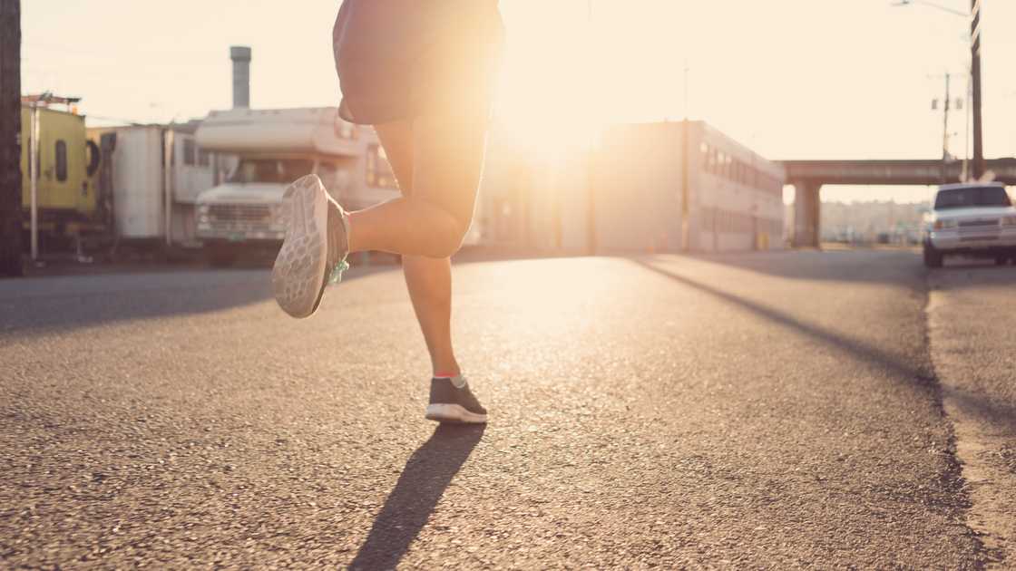 A teen running early in the morning