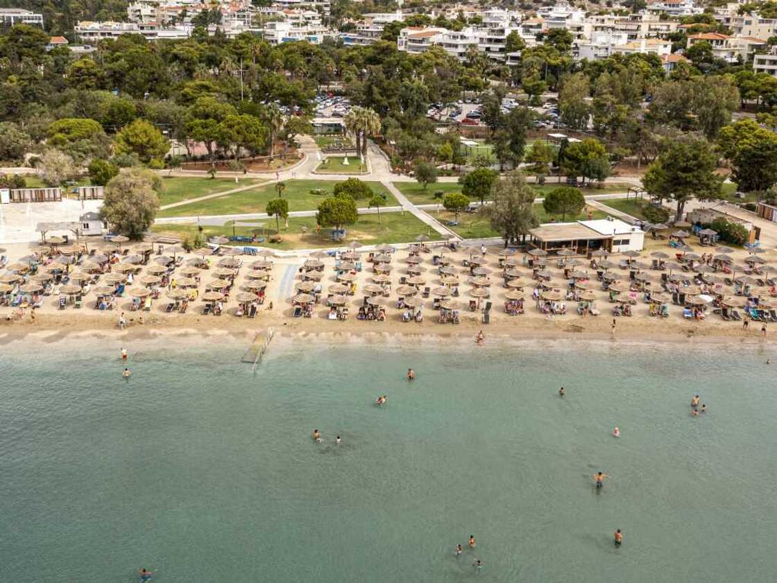 Greek law says 50 percent of every beach must be clear so people can get to the sea Greek law says 50 percent of every beach must be clear so people can get to the sea