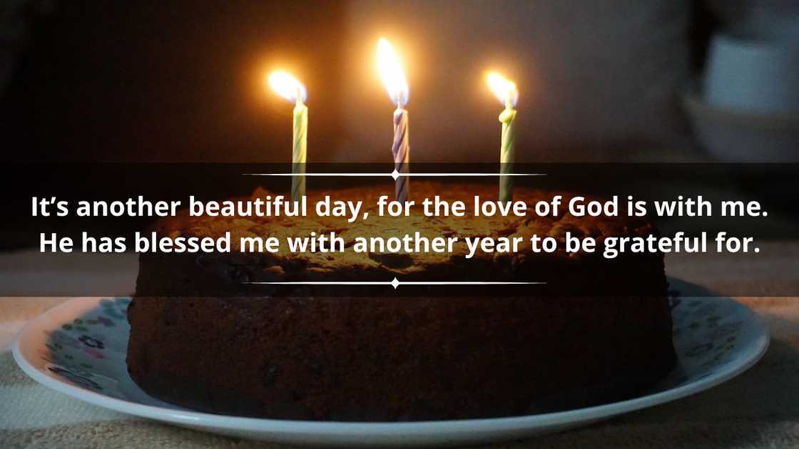 A simple chocolate cake with three candles