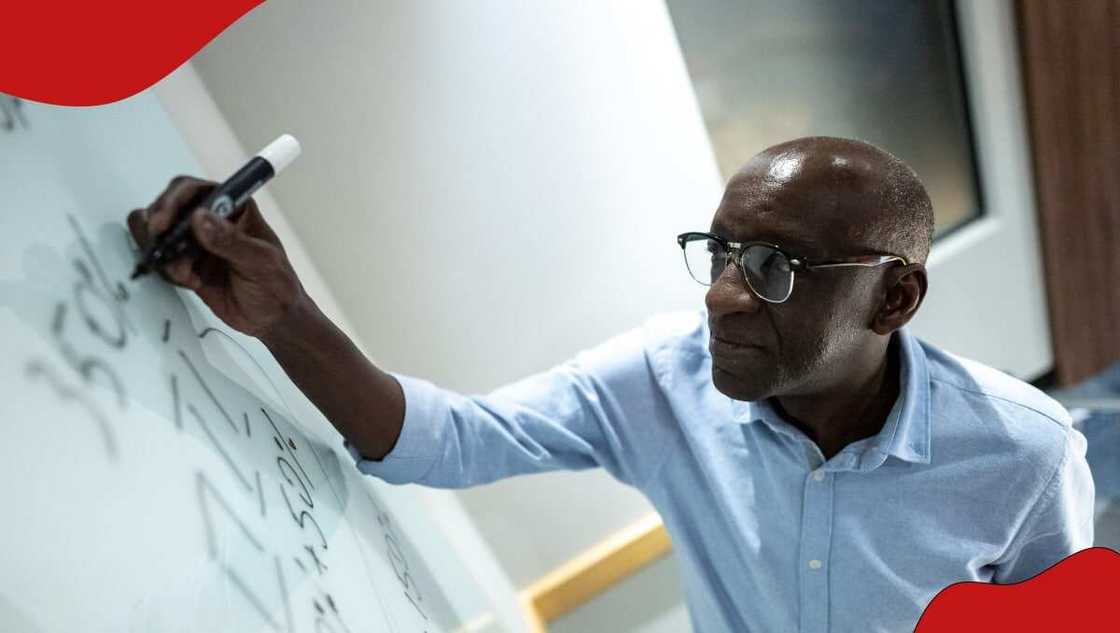 Man solving equation Man solving equation