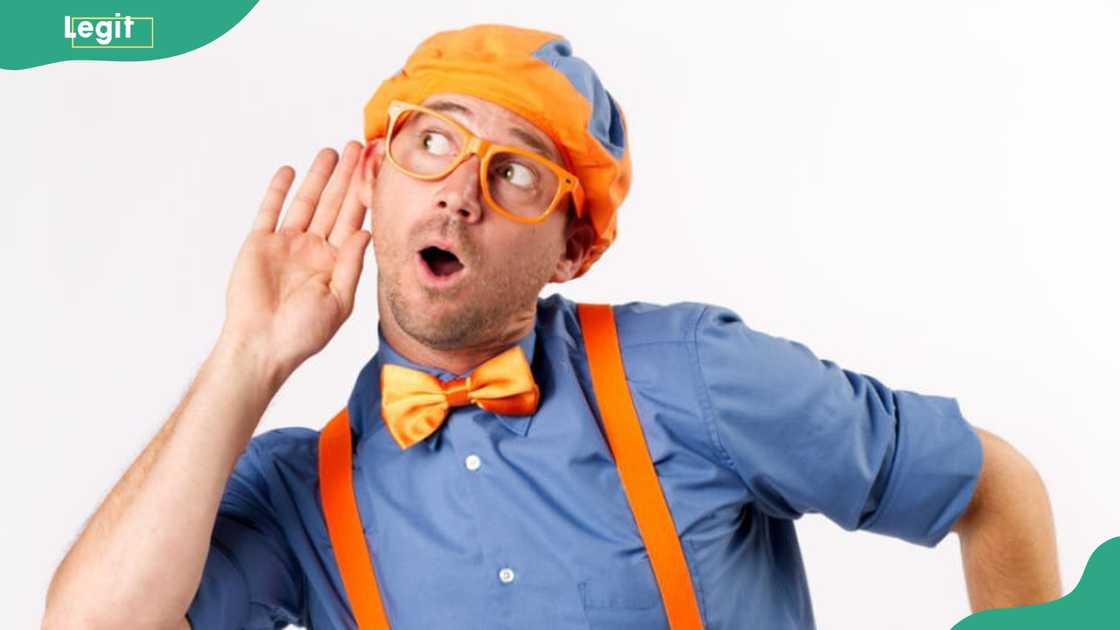 Steve John, the original Blippi holding his hand to his ear Steve John, the original Blippi holding his hand to his ear