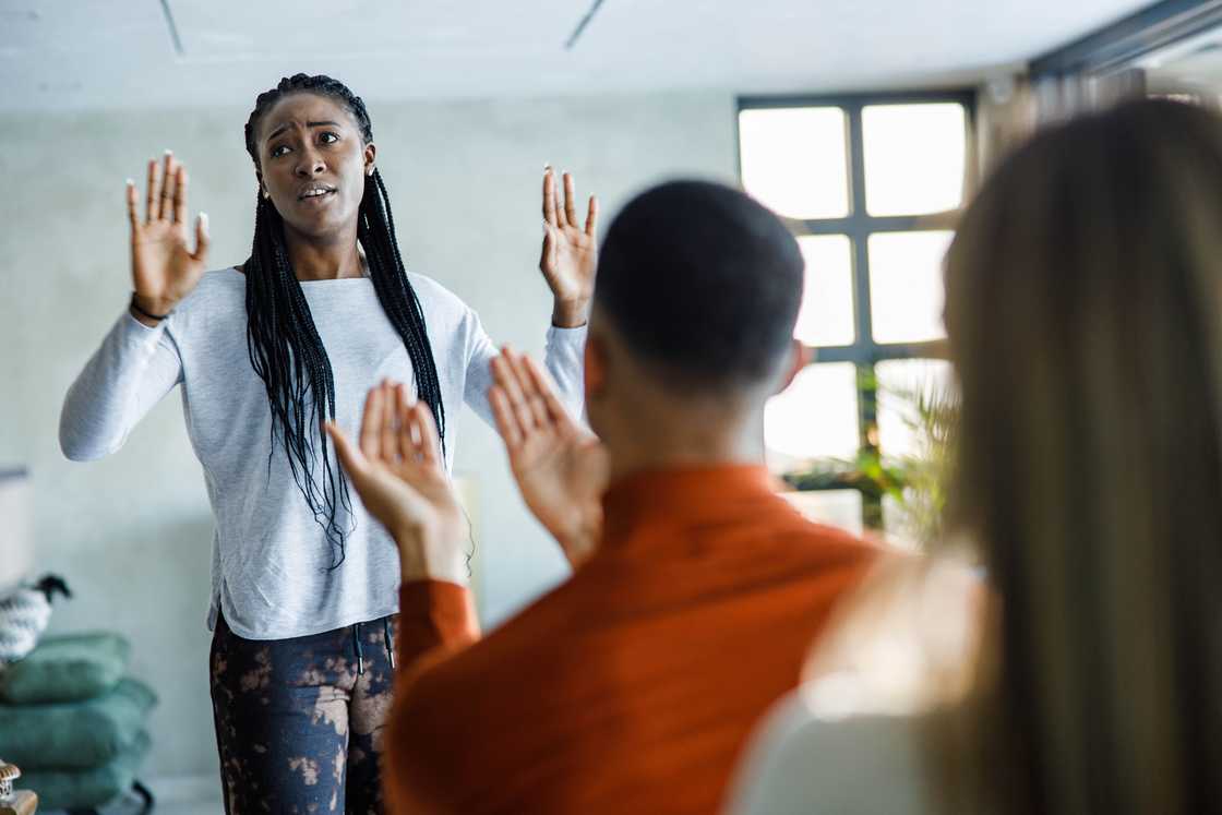 A man pleading with a woman A man pleading with a woman
