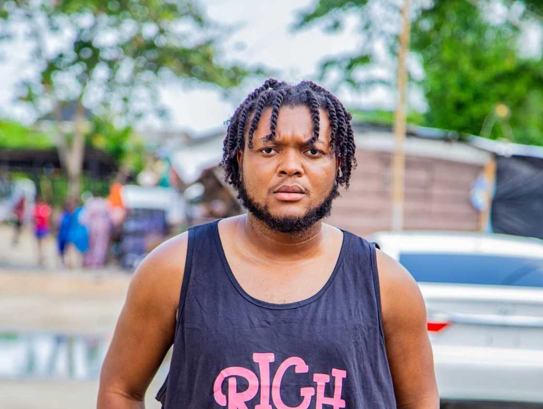 Deacon Famous posing on the street Deacon Famous posing on the street