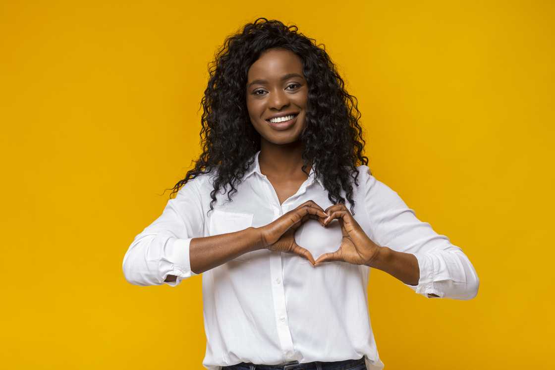 A lady is signing I love you A lady is signing I love you