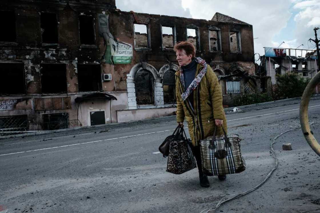 A trickle of refugees have been walking through the shellfire towards Ukrainian territory A trickle of refugees have been walking through the shellfire towards Ukrainian territory