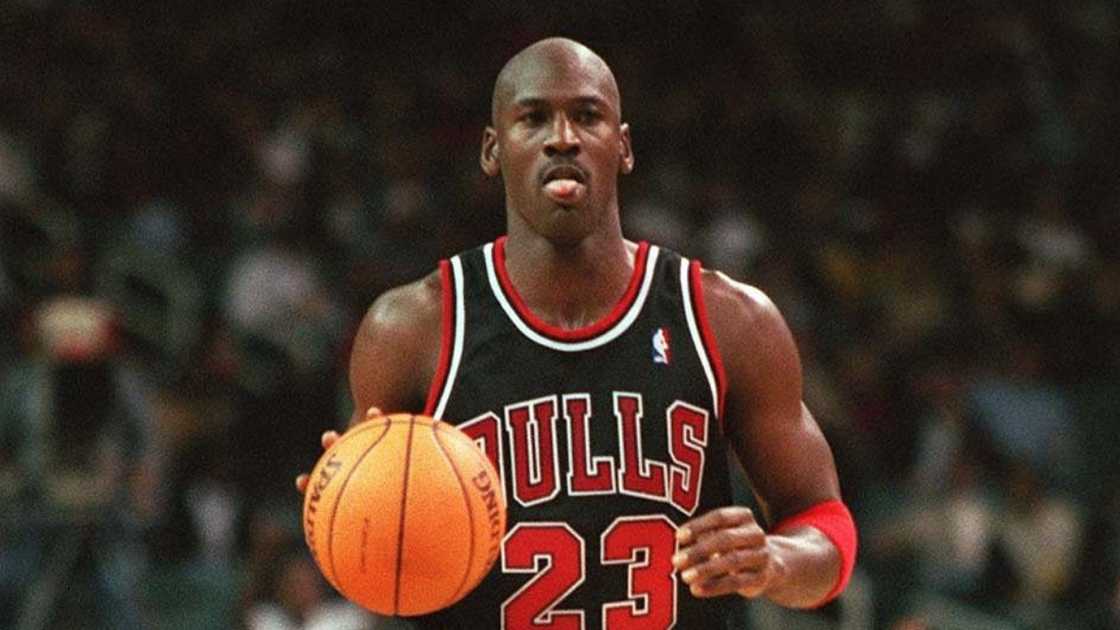 Michael Jordan of the Chicago Bulls dribbles a basketball.