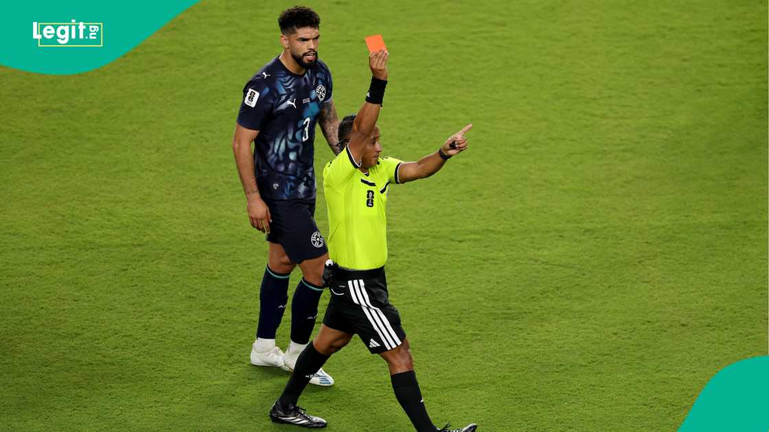 Referee Ivan Barton issues a red card to Miguel Almiron for covering his mouth while talking to another player during the FIFA World Cup 2026. Photo by Stu Forster Referee Ivan Barton issues a red card to Miguel Almiron for covering his mouth while talking to another player during the FIFA World Cup 2026. Photo by Stu Forster