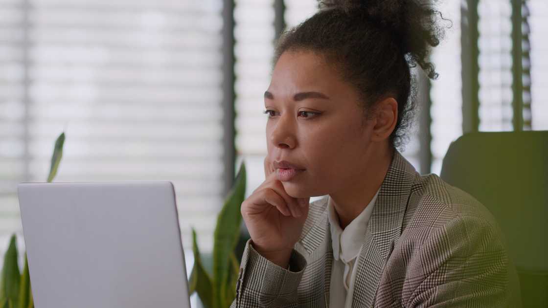 A worried woman watching a CCTV footage A worried woman watching a CCTV footage