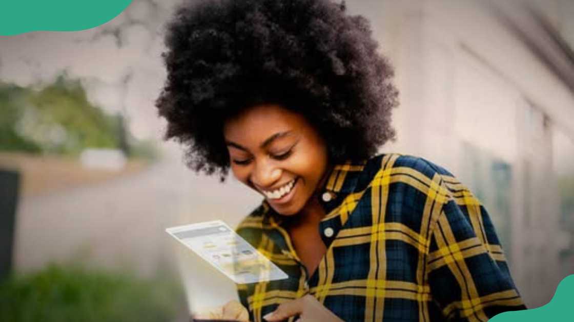 A young woman using a phone. A young woman using a phone.