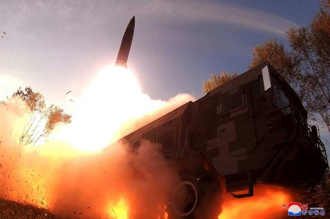 A picture released by North Korean state media on October 10, 2022 shows a missile test launch A picture released by North Korean state media on October 10, 2022 shows a missile test launch